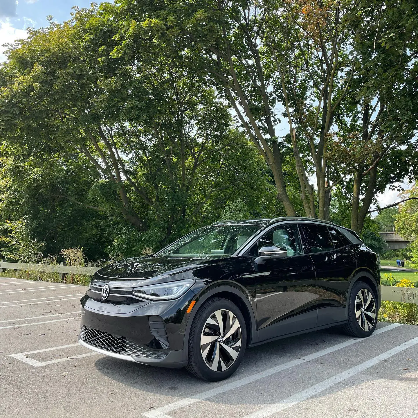 Professional stock photo: EV driver plugging in at urban charging station - Clean energy concept for marketing materials