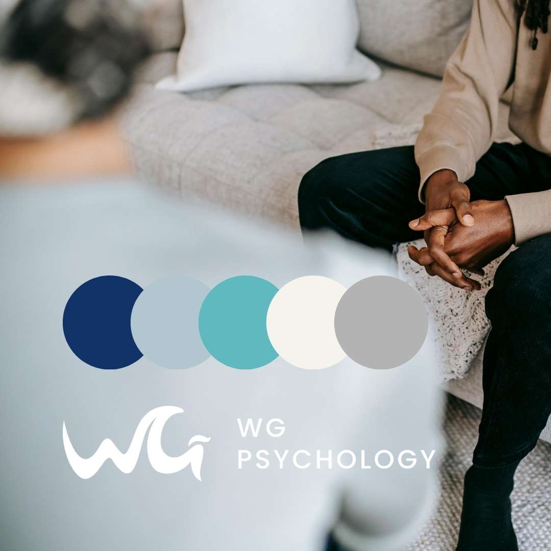 WG Psychology logo with refreshed color palette of navy, soft blue, teal, cream, and gray displayed over a therapy session photo