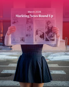 Woman holding a newspaper with “Marketing News Round Up March 2026” overlay, representing weekly marketing news including brand campaigns, LinkedIn updates, and social media trends