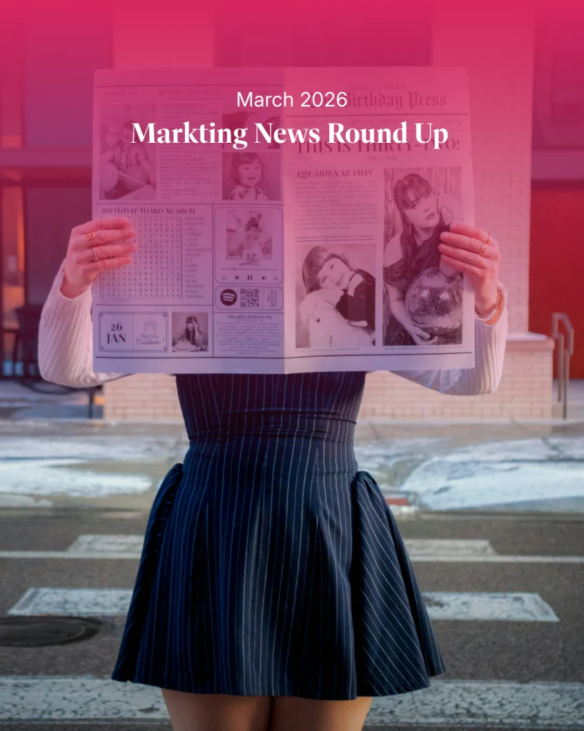 Woman holding a newspaper with “Marketing News Round Up March 2026” overlay, representing weekly marketing news including brand campaigns, LinkedIn updates, and social media trends