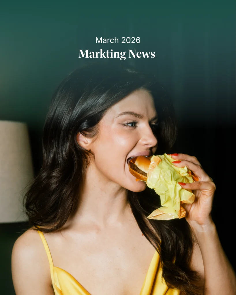 Woman taking a big bite of a burger representing the viral McDonald’s Big Arch burger video that sparked a social media reaction and brand responses from Burger King and Wendy’s in the March 2026 marketing news roundup.