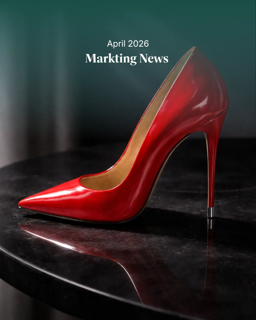 Glossy red stiletto heel on a dark reflective surface with dramatic lighting, styled as a high-fashion editorial image evoking luxury and fashion culture. referencing The Devils wears prada movie